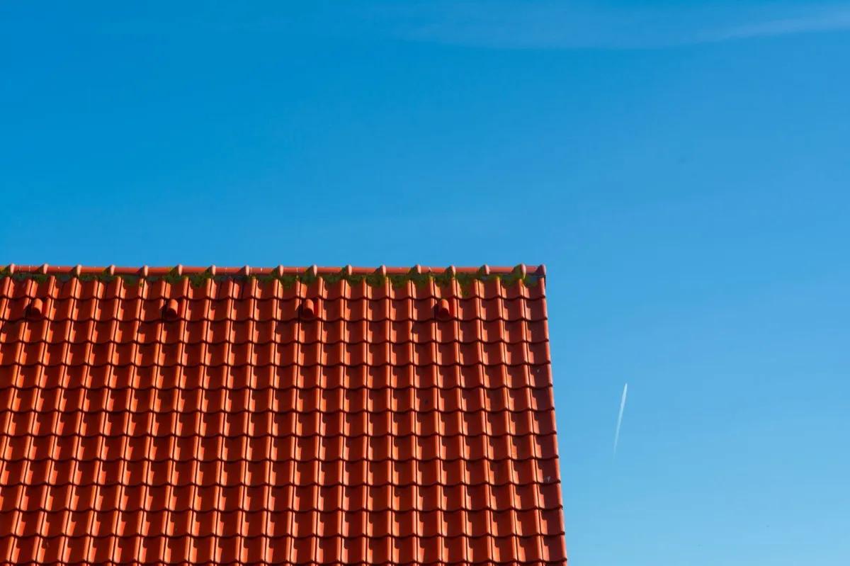 Tile roof gable in full sun, the kind of exposure that sets roof life in Muncie, IN